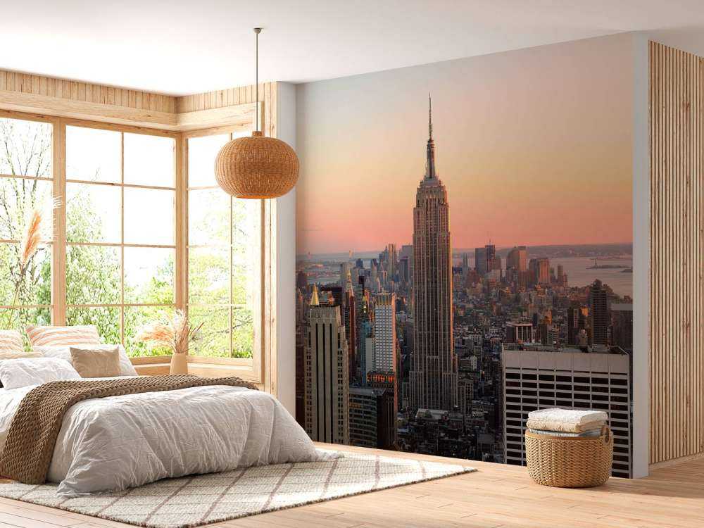 De Skyline van New York bij zonsondergang