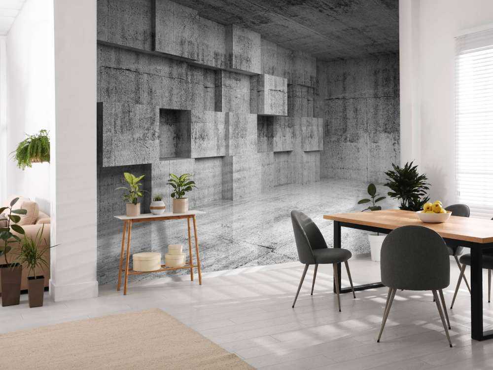 Lege betonnen interieur met decoratie kubussen op de muur