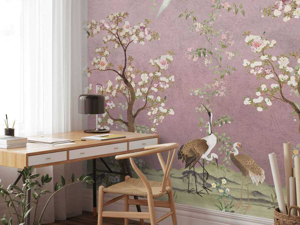 Kraanvogels onder bloesemroze hemel