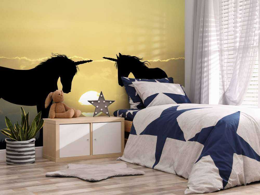 Unicorns bij een zonsondergang