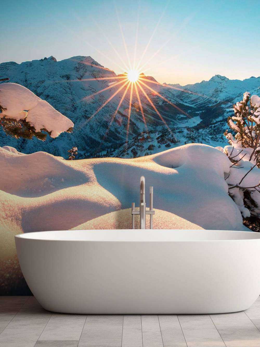 Ochtendzon over besneeuwd dal