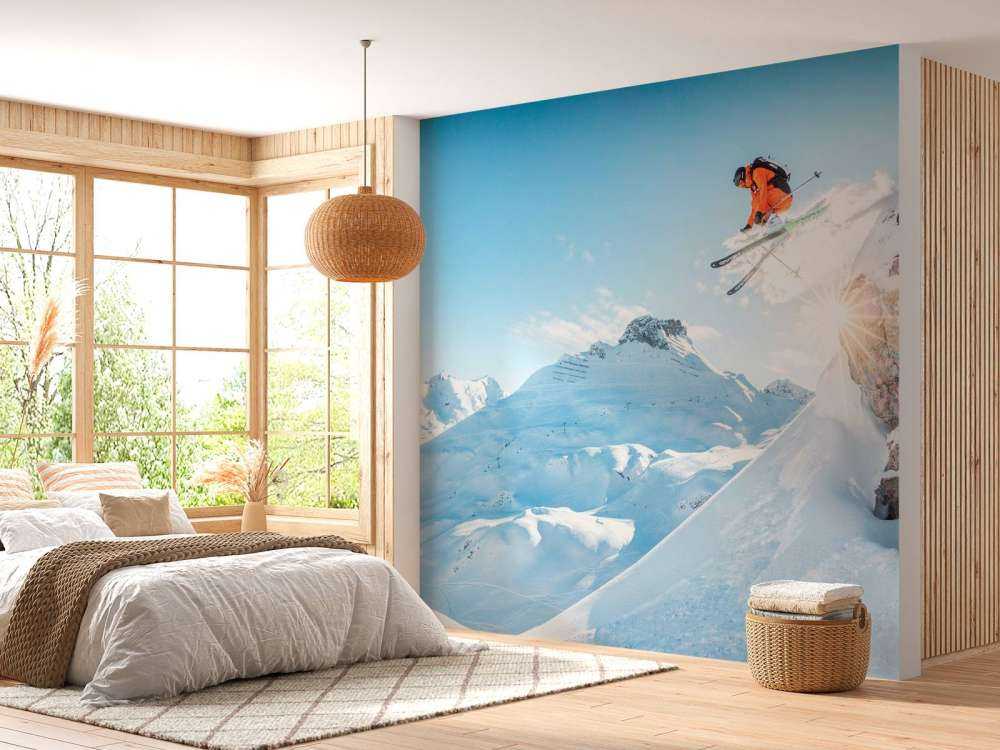 Sprong in besneeuwd berglandschap