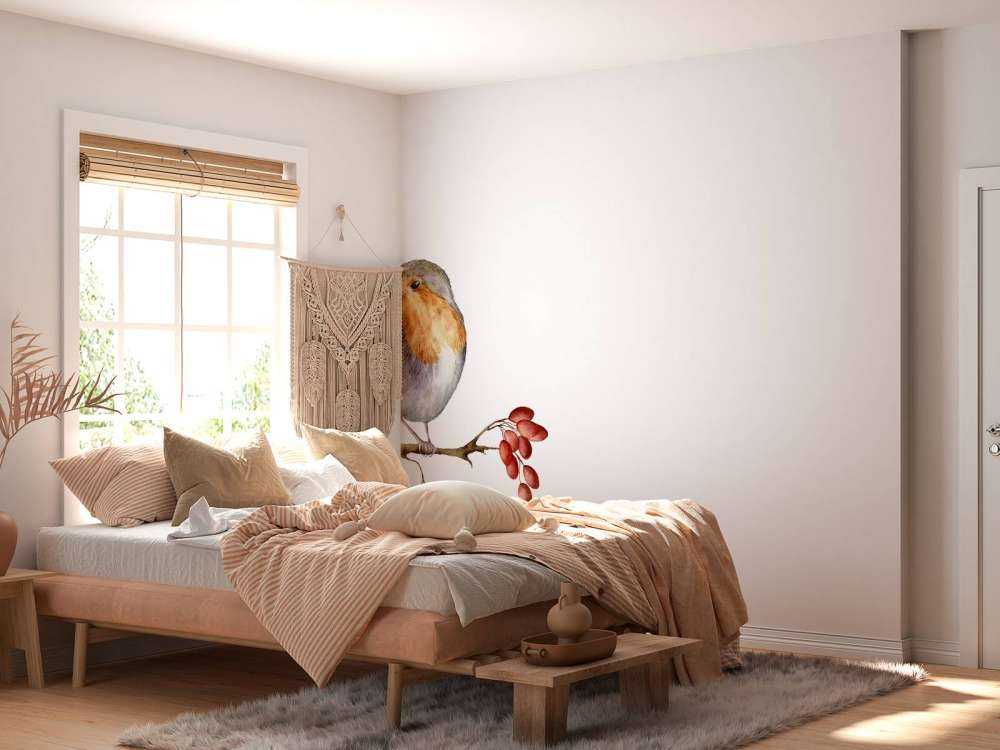 Vogeltje op een takje met een witte achtergrond