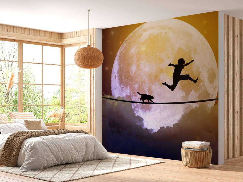 Gelukkige tiener en kat op een koord langs de maan