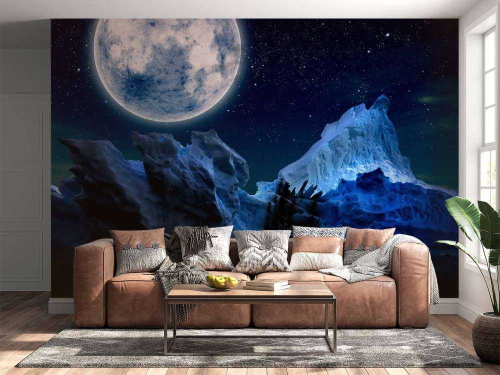 Volle maan boven ijsbergen