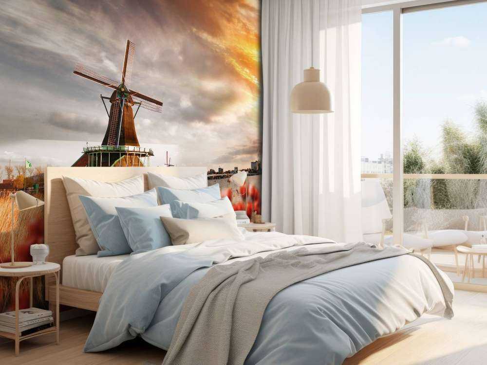 Hollands landschap met molen bij zonsondergang