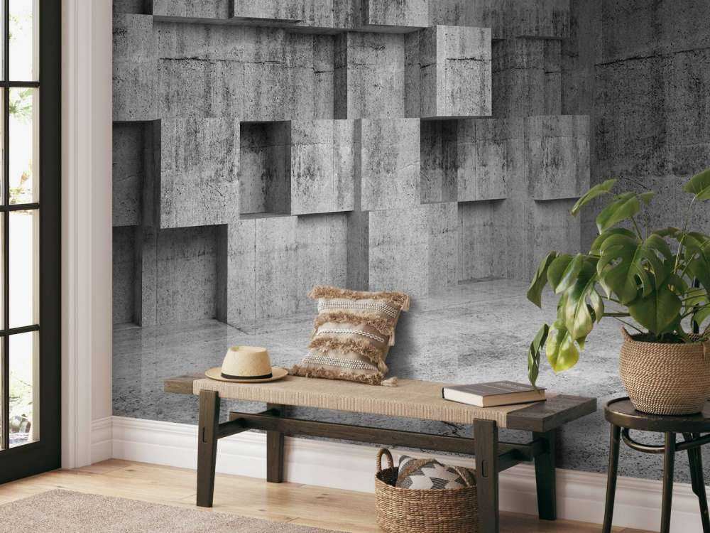 Lege betonnen interieur met decoratie kubussen op de muur