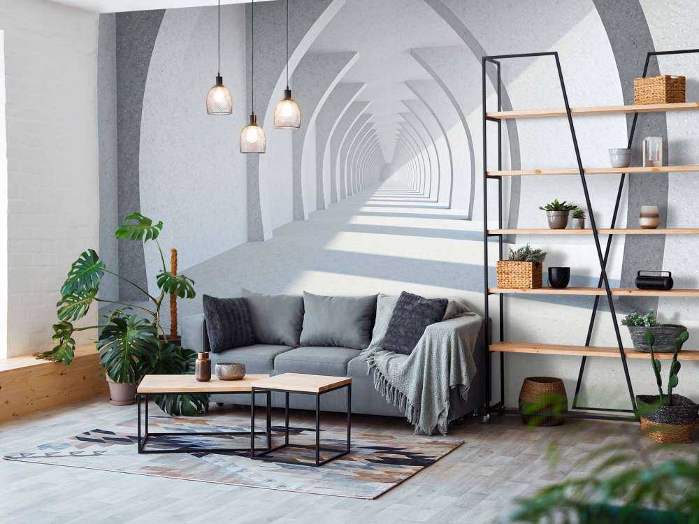 Een lange witte gang met grote zuilen