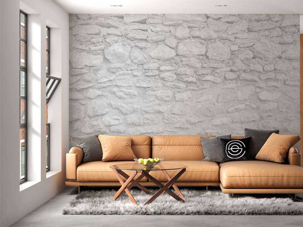 Lichte muur met grove stenen