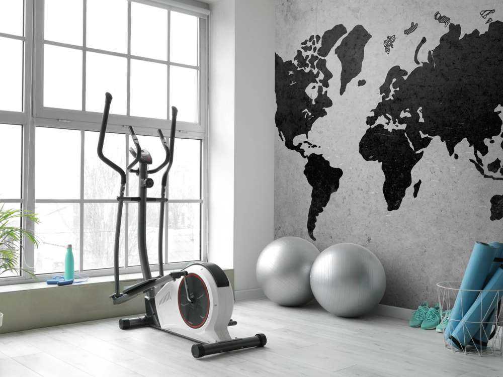 Zwarte wereldkaart op een betonnen muur