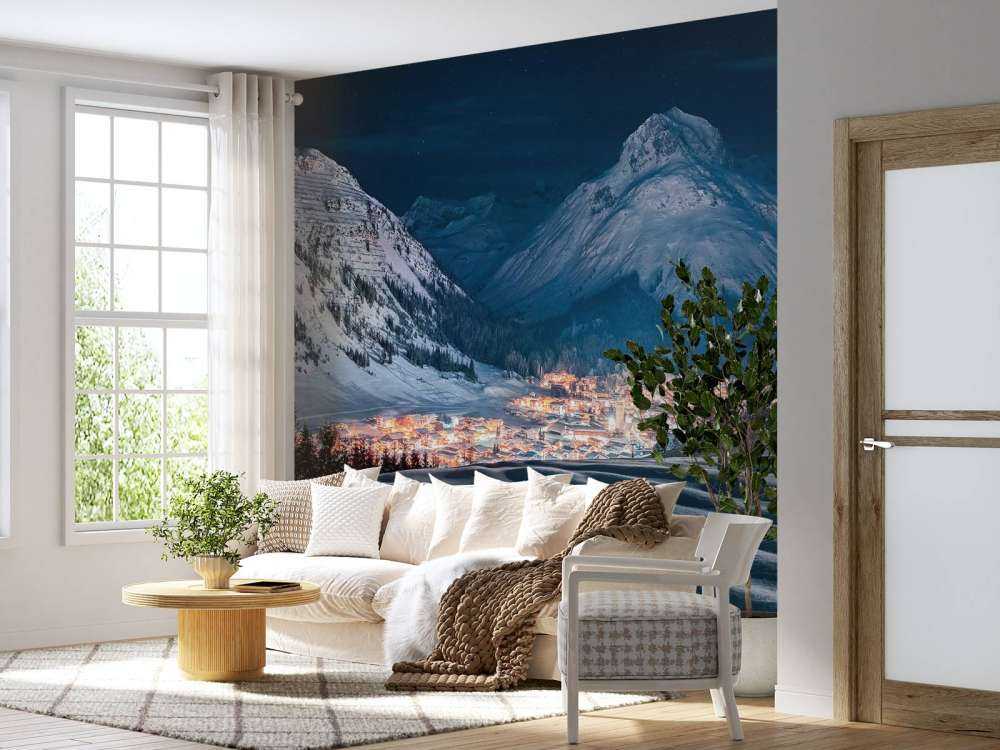 Winterdorp onder maanlicht in alpenvallei