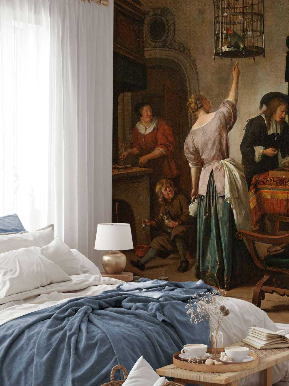 Interieur met een vrouw die een papegaai voert