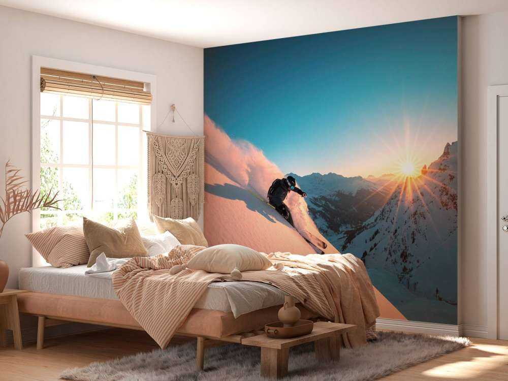 Sneeuwafdaling bij vurige zonsondergang