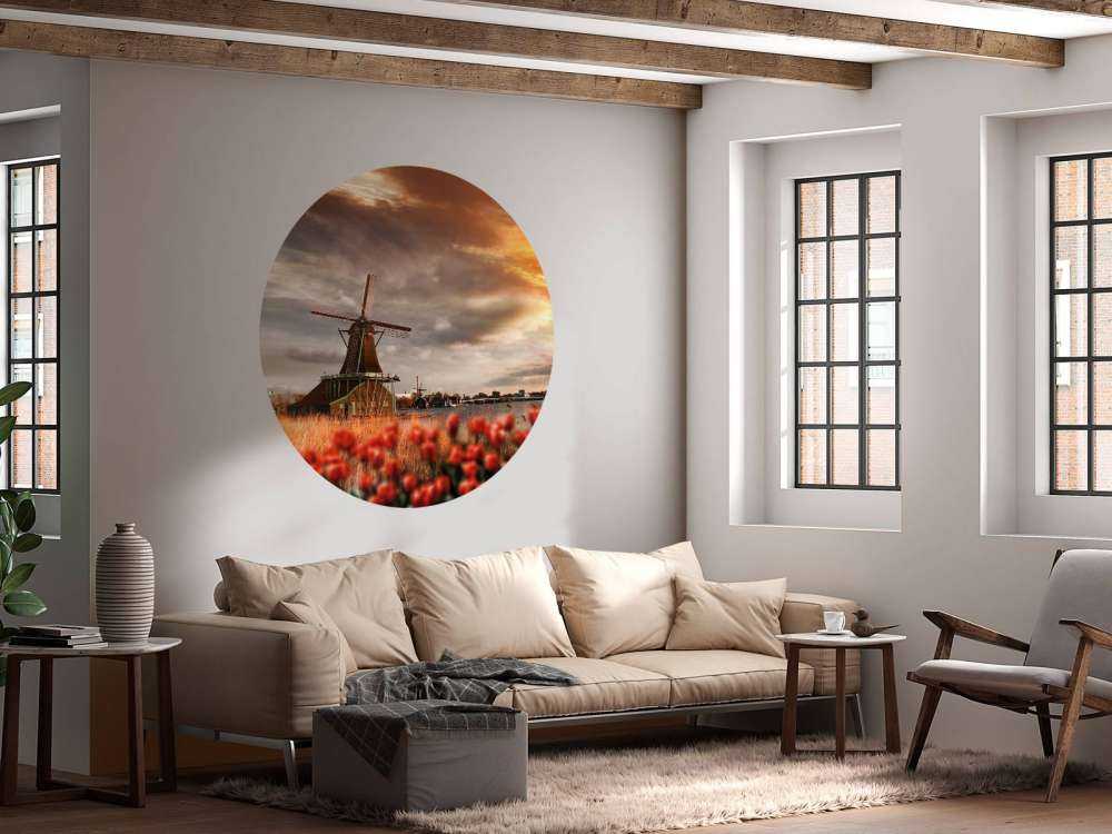 Hollands landschap met molen bij zonsondergang