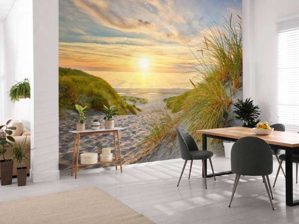Zonsondergang aan duinstrand