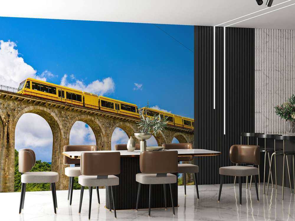 Gele trein op een viaduct in Frankrijk