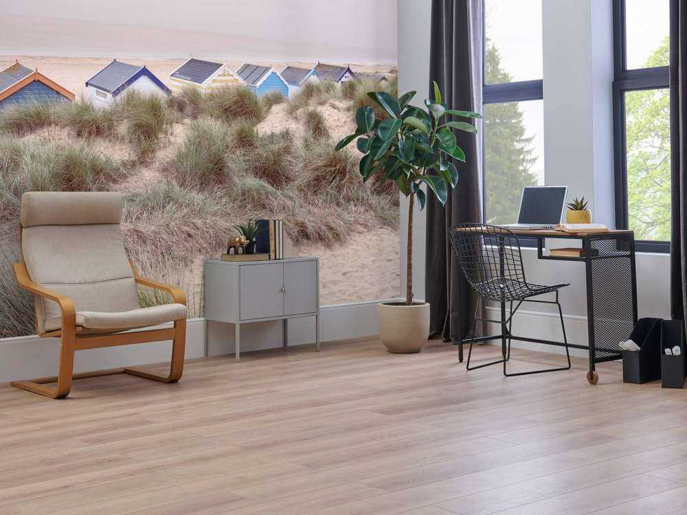 Beach huts on sandy seashore