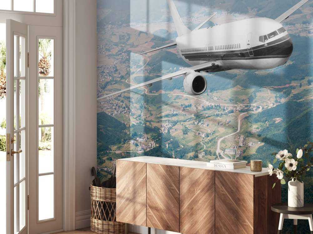 Passagiersvliegtuig boven een berglandschap