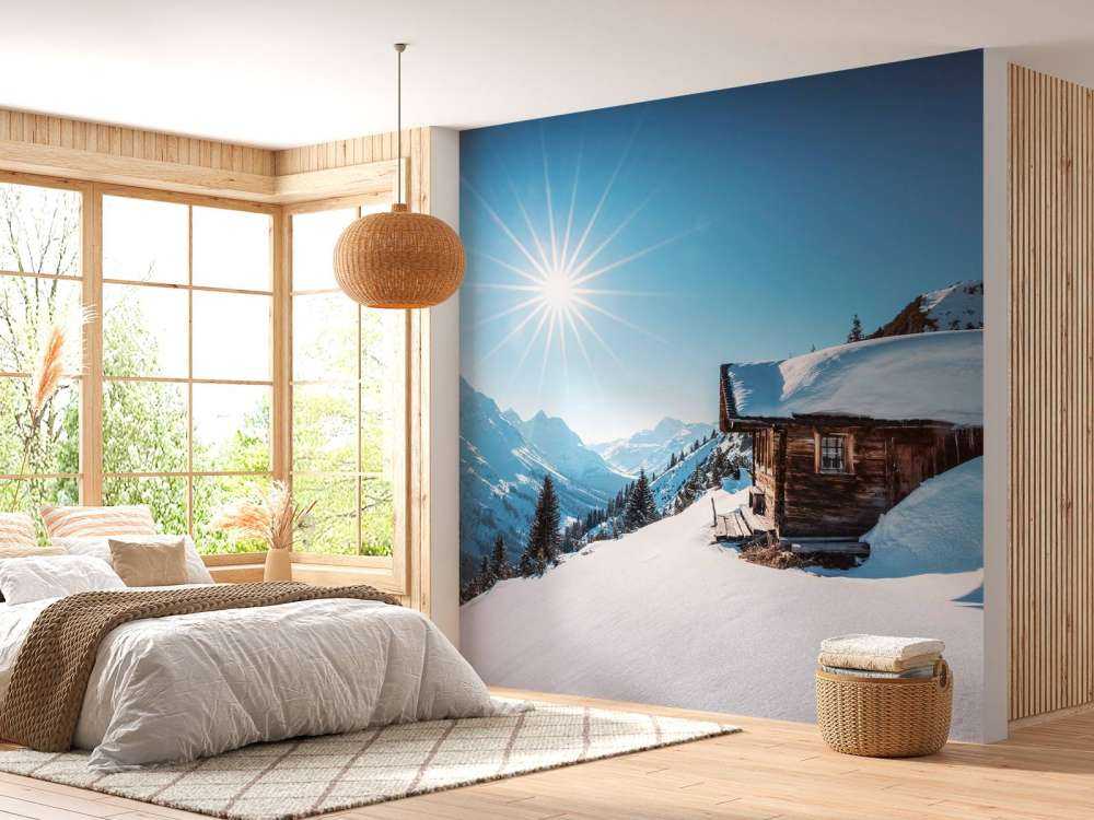 Winterzon boven houten berghut