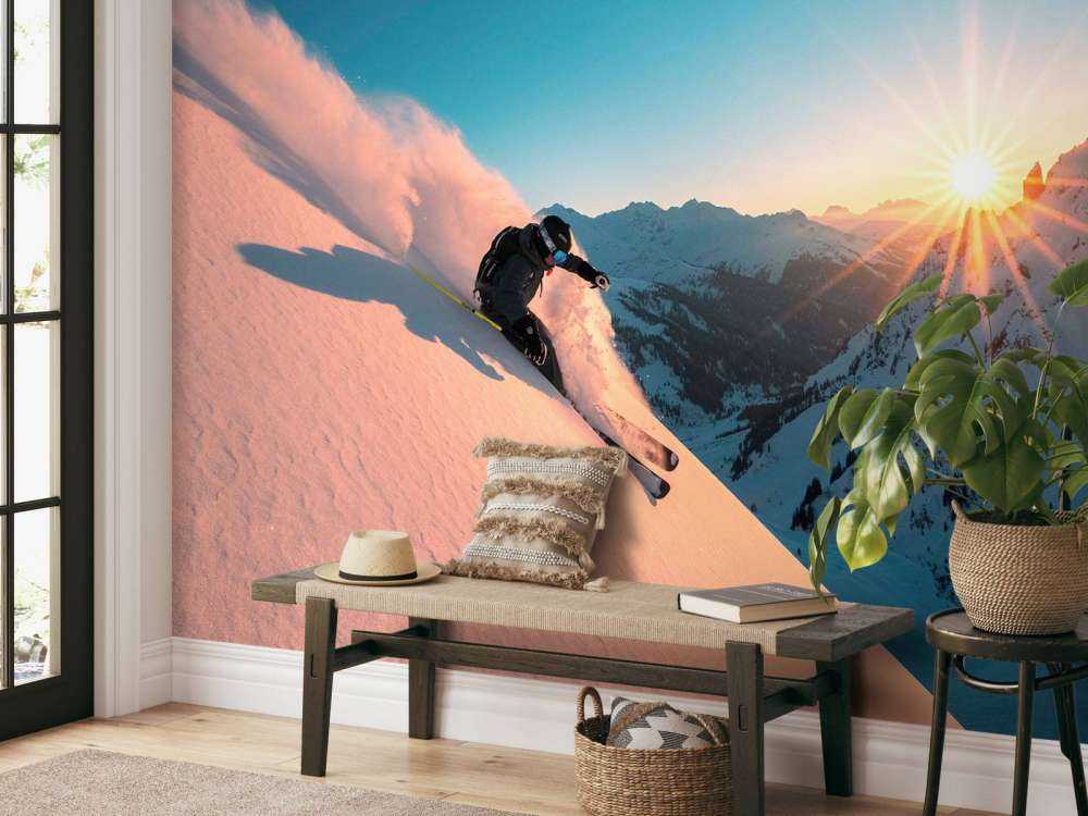 Sneeuwafdaling bij vurige zonsondergang