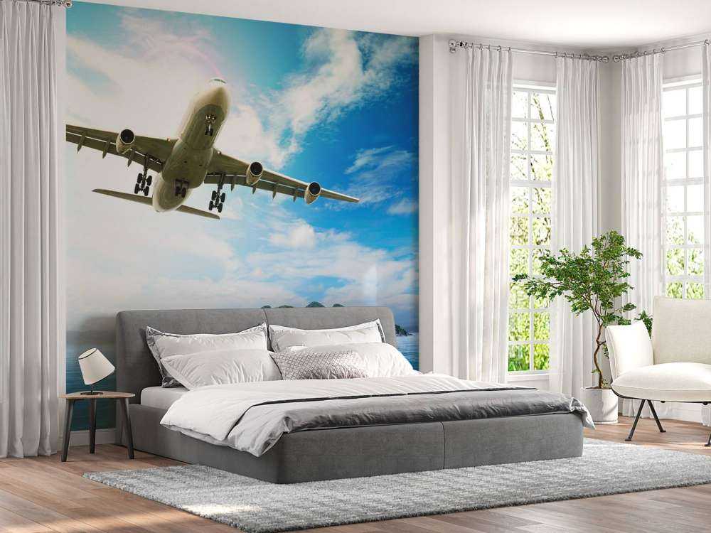 Passagiersvliegtuig boven een tropische zee