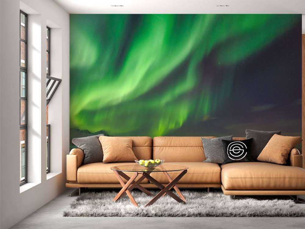 Verlichte stad door het Noorderlicht